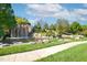 Picturesque backyard water feature with rocks, landscaping, and a small waterfall feature at 710 Legacy Falls S S Dr, Chapel Hill, NC 27517