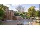 Scenic view of a backyard waterfall cascading into a pond surrounded by lush greenery at 710 Legacy Falls S S Dr, Chapel Hill, NC 27517