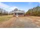 Cozy home exterior featuring a screened porch and wooden deck for outdoor enjoyment at 7415 Old Oxford Rd, Bahama, NC 27503
