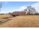Back exterior of home with deck and convenient access to basement garage at 7415 Old Oxford Rd, Bahama, NC 27503