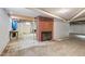 This basement features a brick fireplace and unfinished ceiling, offering plenty of space for customization at 7415 Old Oxford Rd, Bahama, NC 27503