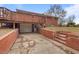 Basement garage with attached deck above and brick paver entrance at 7415 Old Oxford Rd, Bahama, NC 27503