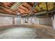 This is a view of an unfinished basement with access to a garage at 7415 Old Oxford Rd, Bahama, NC 27503