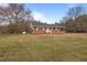 Charming brick home with a well-maintained lawn and inviting front entrance at 7415 Old Oxford Rd, Bahama, NC 27503