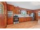 Efficient kitchen featuring ample wood cabinetry, stainless steel appliances and lots of counter space at 7415 Old Oxford Rd, Bahama, NC 27503