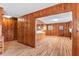 Open concept kitchen offering wood cabinetry, countertop space and a view into the living room at 7415 Old Oxford Rd, Bahama, NC 27503