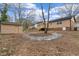 Spacious backyard features a storage shed and a wooden deck with steps at 7725 Longstreet Dr, Raleigh, NC 27615