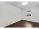 Bedroom featuring neutral paint and wood floors with a window allowing natural light to enter the room at 7725 Longstreet Dr, Raleigh, NC 27615