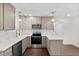 Modern kitchen featuring stainless steel appliances, quartz countertops, and soft-close cabinetry at 7725 Longstreet Dr, Raleigh, NC 27615