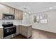 Modern kitchen featuring stainless steel appliances, quartz countertops, and eat-in island at 7725 Longstreet Dr, Raleigh, NC 27615
