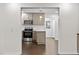 Eat-in kitchen showcasing pendant lighting, new appliances, and pristine, white subway tile at 7725 Longstreet Dr, Raleigh, NC 27615