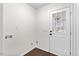 This mud room features hardwood floors, a washer hookup, and a door with glass paneling to let in natural light at 7725 Longstreet Dr, Raleigh, NC 27615