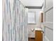 Cozy bathroom featuring a sink, toilet, and shower curtain at 805 S 11Th St, Lillington, NC 27546