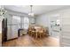Cozy dining room featuring a table with chairs and a door leading to the kitchen at 805 S 11Th St, Lillington, NC 27546