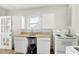 Laundry area with a sink, stove and storage cabinets at 805 S 11Th St, Lillington, NC 27546