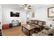 Inviting living room with a ceiling fan, entertainment center, and leather sofa at 805 S 11Th St, Lillington, NC 27546