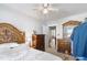 Bright main bedroom with a decorative wood headboard and traditional dressers at 805 S 11Th St, Lillington, NC 27546