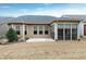 Large backyard features a covered patio, screened in porch, and well manicured landscaping at 823 Atticus Way, Durham, NC 27703