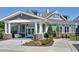 Community clubhouse featuring beautiful stonework, well maintained landscaping, and ample parking at 823 Atticus Way, Durham, NC 27703