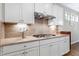 A well-appointed kitchen boasts granite countertops, a gas cooktop, and ample cabinet space at 823 Atticus Way, Durham, NC 27703