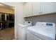 Laundry room features new washer and dryer with access to a spacious walk-in closet at 823 Atticus Way, Durham, NC 27703