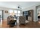 Living room with wood floors, neutral colors, and a ceiling fan at 823 Atticus Way, Durham, NC 27703