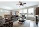 A cozy living room shows neutral colors and a ceiling fan at 823 Atticus Way, Durham, NC 27703