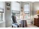 Cozy sitting area with a chair and decorative pillows in the main bedroom at 823 Atticus Way, Durham, NC 27703