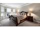 A spacious main bedroom features a tray ceiling and large windows at 823 Atticus Way, Durham, NC 27703