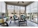 Bright sun room filled with wicker furniture and lots of light at 823 Atticus Way, Durham, NC 27703