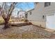 Spacious backyard with a wood deck and stairs that lead to the sliding glass door at 8341 Wynewood Ct, Raleigh, NC 27616