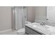 Bathroom features a granite sink, toilet, and a shower with a glass door at 8341 Wynewood Ct, Raleigh, NC 27616