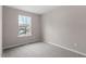 Bright bedroom with neutral walls, carpet flooring, and a window providing natural light at 8341 Wynewood Ct, Raleigh, NC 27616