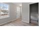 Light and bright entry with gray paint and luxury vinyl plank flooring at 8341 Wynewood Ct, Raleigh, NC 27616