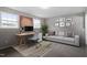 Functional home office with a desk, comfortable seating, and a well-lit workspace at 8341 Wynewood Ct, Raleigh, NC 27616