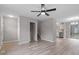 Spacious living room offers luxury vinyl plank flooring, gray walls, and natural light at 8341 Wynewood Ct, Raleigh, NC 27616