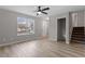 This spacious living room has gray walls and new luxury vinyl plank flooring at 8341 Wynewood Ct, Raleigh, NC 27616