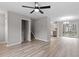 Open-concept living space features new luxury vinyl plank flooring and gray walls at 8341 Wynewood Ct, Raleigh, NC 27616
