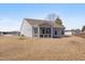 Spacious backyard featuring a screened porch and ample space for outdoor activities at 84 Nonabell Ln, Four Oaks, NC 27524