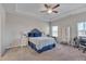 Serene main bedroom with a trey ceiling, soft carpet, and ample natural light at 84 Nonabell Ln, Four Oaks, NC 27524