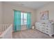 Bright bedroom features plush carpet, ample natural light, and a large dresser at 84 Nonabell Ln, Four Oaks, NC 27524
