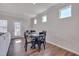 Cozy dining area features natural light, wood floors, and access to the outdoor space at 84 Nonabell Ln, Four Oaks, NC 27524