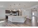 Modern kitchen with a center island, granite countertops, and dark wood cabinets at 84 Nonabell Ln, Four Oaks, NC 27524