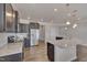 Beautiful kitchen featuring granite countertops, stainless steel appliances, and dark cabinetry at 84 Nonabell Ln, Four Oaks, NC 27524