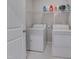 Practical laundry area equipped with washer, dryer, and storage shelf at 84 Nonabell Ln, Four Oaks, NC 27524