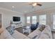 Inviting living room with comfortable seating, a ceiling fan, and plenty of natural light at 84 Nonabell Ln, Four Oaks, NC 27524