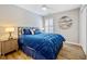 Cozy bedroom offers a comfortable bed, side table, and great natural light from a nearby window at 912 Homestead Park Dr, Apex, NC 27502