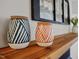 Modern home decor items displayed on a wooden shelf with a picture frame in the background at 912 Homestead Park Dr, Apex, NC 27502