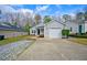 Charming single-story home with a driveway, one-car garage, and manicured landscaping at 912 Homestead Park Dr, Apex, NC 27502