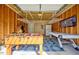 Finished garage with fun game room has ping pong and foosball tables for entertaining Gathering and friends at 912 Homestead Park Dr, Apex, NC 27502